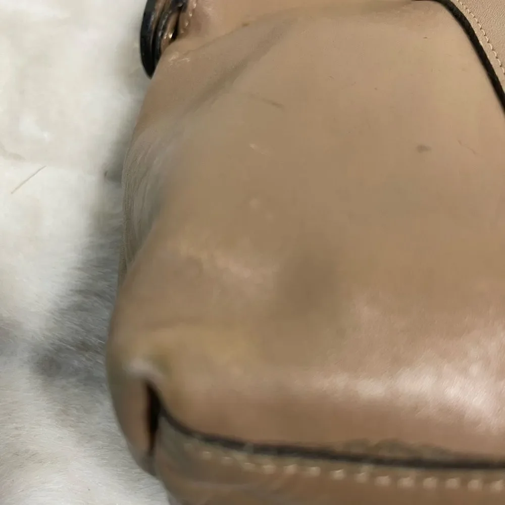 Tano Leather tan frame medium satchel gold tone hardwares .